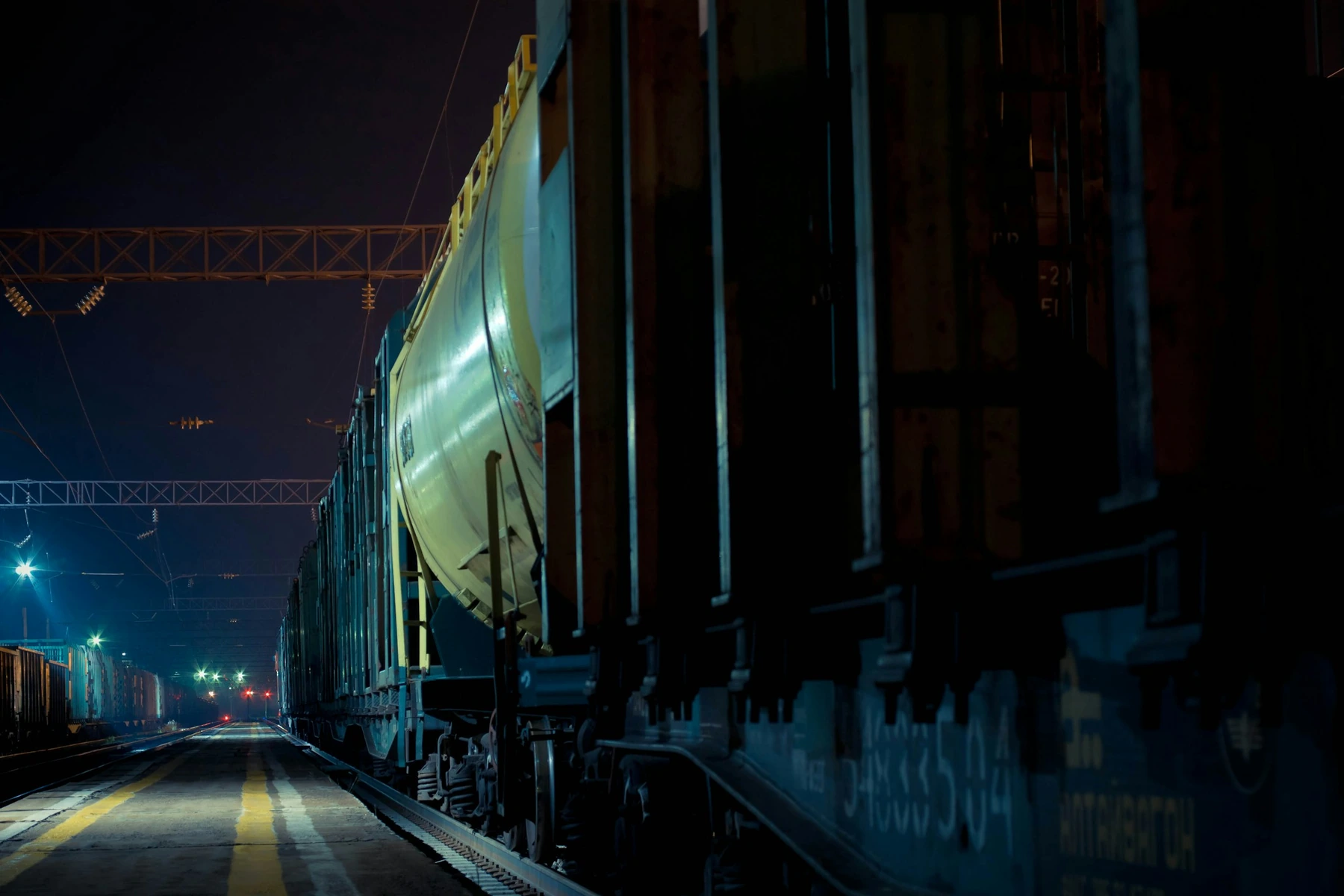 Freight wagons in a railway yard at night